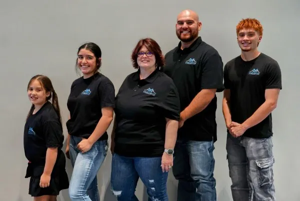 The Ramon Service Company family, in company shirts